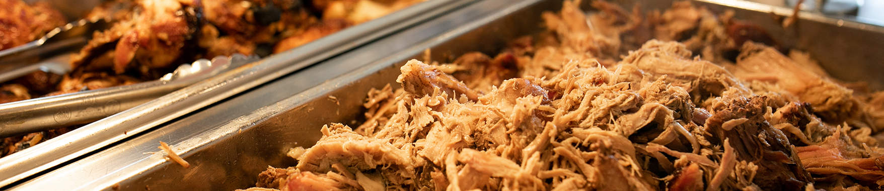 slow-cooked pork in serving tray